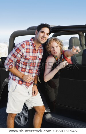 ストックフォト: Woman In Jeep Giving Man Directions