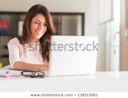 Zdjęcia stock: Portrait Of A Beautiful Smiling Woman Typing On Laptop