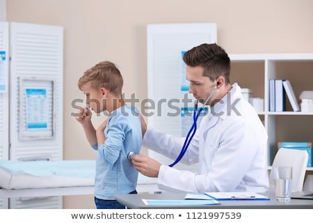 [[stock_photo]]: Doctor Examining Coughing Patient