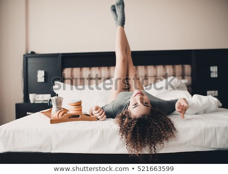 Stok fotoğraf: Pretty Young Woman Having A Breakfast In The Bed
