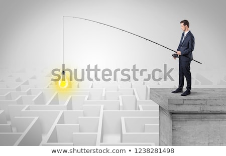 [[stock_photo]]: Businessman Fishing New Idea From A Maze Concept