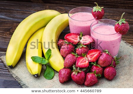 [[stock_photo]]: Strawberries And A Glass Of Milk On Old Wooden Background