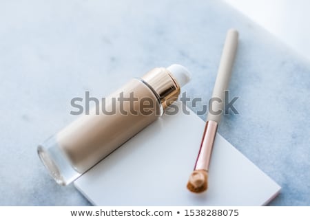 Сток-фото: Makeup Foundation Bottle And Contouring Brush On Marble Make Up