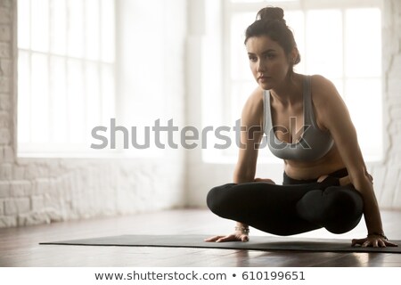 Stockfoto: Woman Doing Ashtanga Vinyasa Yoga Arm Balance Asana Tolasana