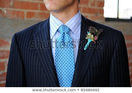 ストックフォト: Blue Pinstriped Suit With Tie And Boutonniere