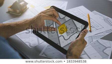 Zdjęcia stock: Tablet On A Desk - Urbanization