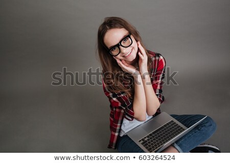 Stockfoto: Incredible Young Lady Posing Over Grey Background