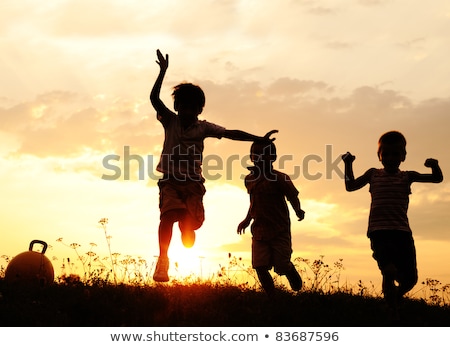 Stockfoto: Silhouette Of Family Running In Circle