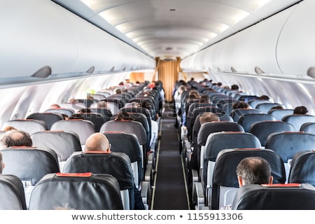 Сток-фото: Interior Of Commercial Airplane With Passengers In Their Seats
