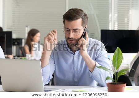 Foto stock: Consultant Businessman Talking On Cell Clients