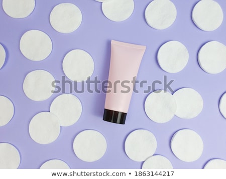 Stockfoto: Organic Cotton Pads On Purple Background Cosmetics And Make Up