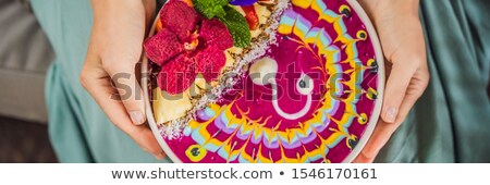 Сток-фото: Banner Long Format Young Woman Having A Mediterranean Breakfast Seated At Her Sofa And Eats Healthy