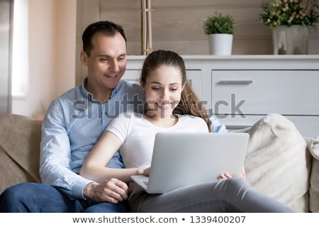 Stock photo: Older Business Couple Looking At A Laptop