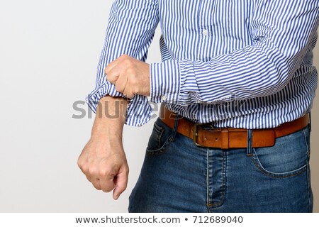 Stockfoto: Rolling Up His Sleeves