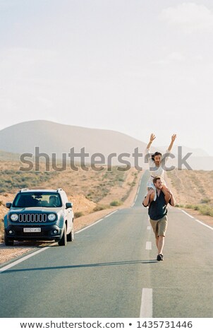 Foto stock: Young Man In Countryside With Suv