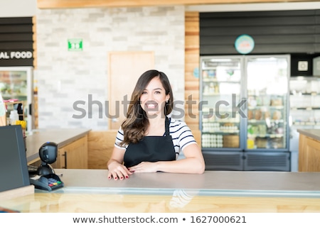 Stok fotoğraf: Cashier At Supermarket Checkout