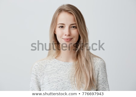 Stok fotoğraf: Portrait Of A Happy Young Woman Dressed In Sweater