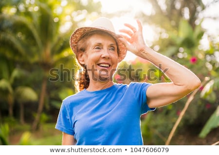 [[stock_photo]]: Portrait Of An Older Woman Outside His House On The Warm Center Equator