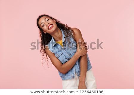 Stok fotoğraf: Portrait Of A Pretty African Woman Dressed In Denim Vest