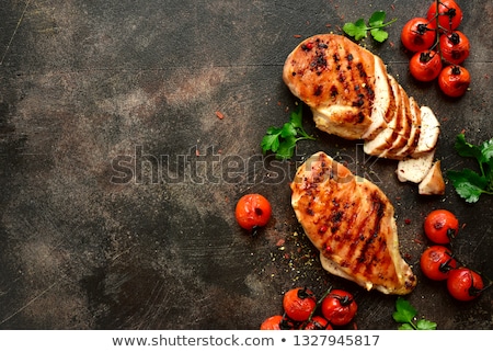 Stok fotoğraf: Grilled Chicken Breast With Sauce And Cherry Tomatoes