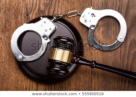 Stockfoto: Handcuffs And Gavel In Courtroom