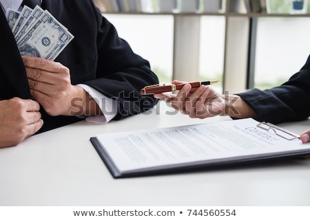 Stockfoto: Bribery And Corruption Concept Bribe In The Form Of Dollar Bill