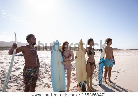 Stock fotó: Front View Of Shirtless Young Male Surfer With Surfboard Standing On Beach In The Sunshine