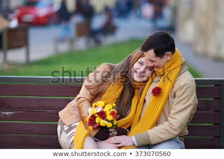 Stok fotoğraf: A Woman In A Wedding Dress In A Spring Garden With Trees At The Moment Of Flowering