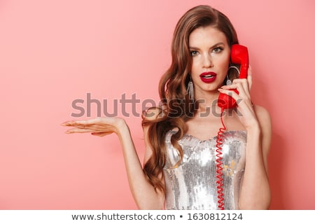 Foto stock: Woman In Bright Sequins Dress Isolated Over Pink Wall