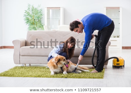 Сток-фото: The Husband Cleaning House From Dog Fur