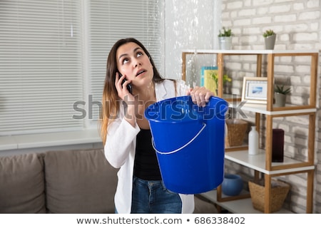 Foto stock: Water Droplets Leak From Ceiling In Kitchen