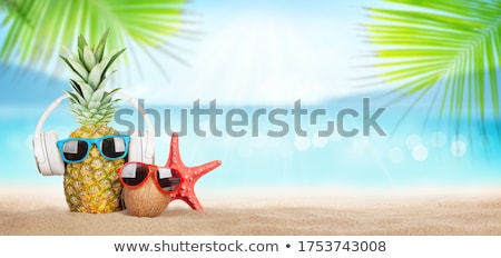 Foto stock: Pineapple And Coconut With Sunglasses And Headphones