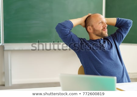 Foto stock: Teacher Relaxes In Class