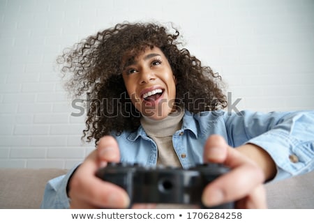 Stock photo: Female Hands With A Gamepad