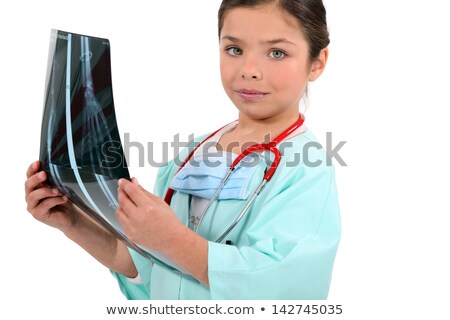 Foto d'archivio: Young Girl Pretending To Be A Radiologist