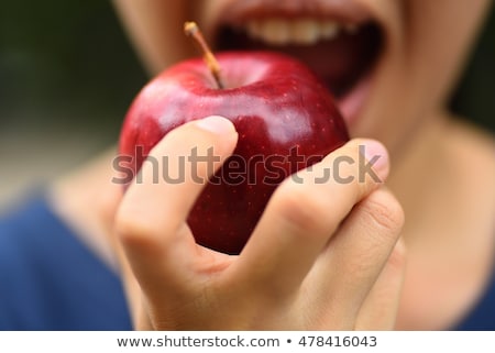 Stok fotoğraf: Woman Biting A Fresh Red Apple