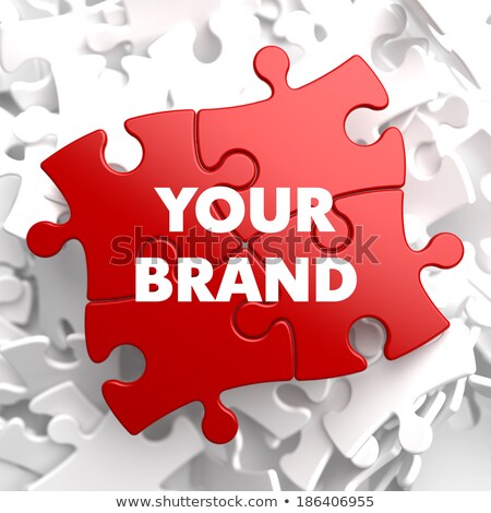 Foto d'archivio: Your Brand Concept On Red Puzzle