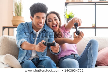 ストックフォト: Siblings Playing Video Games