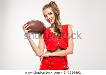 Stock fotó: Female Cheerleader With Rugby Ball