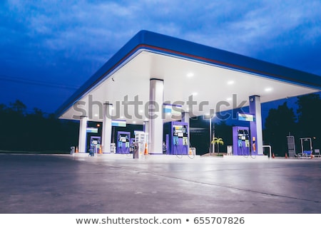 Stock fotó: Car Refueling On A Petrol Station At Night