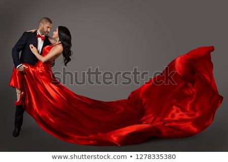 Stok fotoğraf: Dancing Woman In Red Dress On Black Background