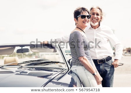 Foto stock: Couple In An Old Convertible