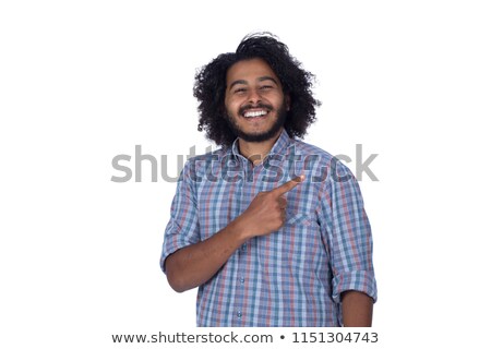 Stock photo: Portrait Of Casual Man Wearing Plaid Shirt Pointing To Side