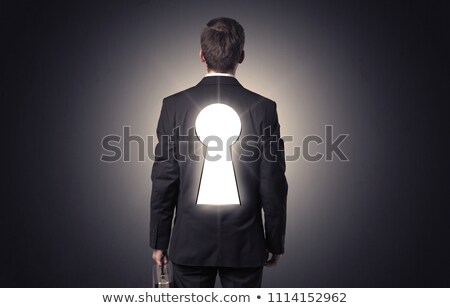 Zdjęcia stock: Businessman Standing With Keyhole On His Back