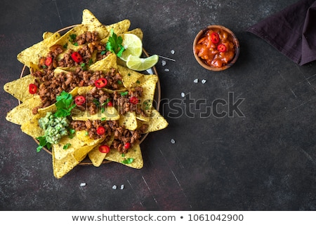 Foto d'archivio: Mexican Corn Nacho Spicy Chips Served With Melted Cheese