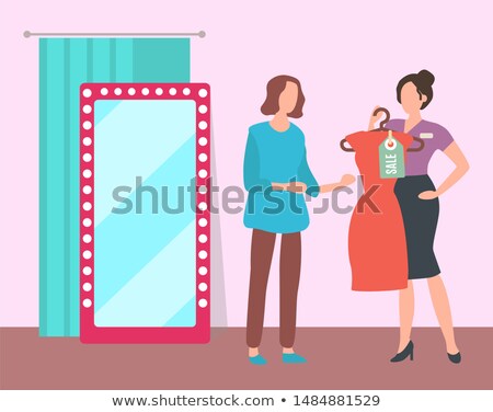 ストックフォト: Girl Trying On Dress In Fashion Boutique Vector