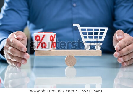 Stock fotó: Hand Protecting Balance Between Percentage And Shopping Cart