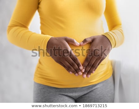 ストックフォト: Pregnant Woman Holding Tummy