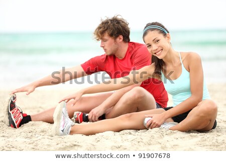 Fitness - Gesundes Paar Dehnen nach dem Training auf Weiß Stock foto © Maridav
