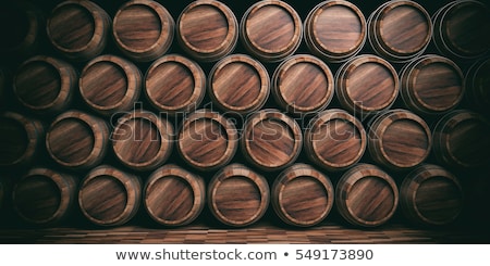 Foto stock: Old Stacked Beer Barrels